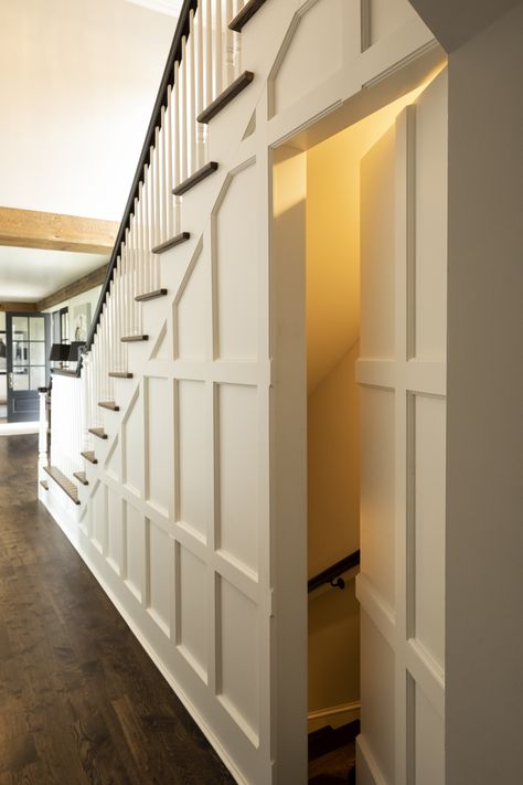 Door Leading To Basement, Wainscoting Secret Door, Kitchen With Staircase In The Middle, Under The Stairs Entryway, Exposed Wood Stairs, Staircase Next To Front Door, Staircase Design Basement, Stairs Under Stairs, Stairs By Kitchen