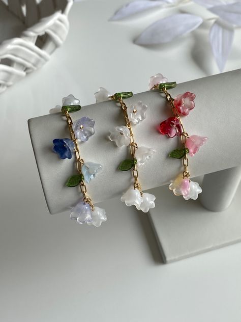 #smallbusiness #smallbusinessowner #smallbusinesssupport #beads #beadsjewelry #beadedjewelry #flowerjewelry #glassbeads #springjewelry #spring2023 #springaesthetic #springtrends #trendyjewelry #cutejewelry #kawaiiaesthetic #cottagecore #cottageaesthetic #cottagecore #cottagecoreaesthetic #fruitjewelry Flower Jewelry Aesthetic, Flower Jewellery Aesthetic, Korean Jewelry Bracelets, Aesthetic Korean Bracelet, Fairycore Flower Jewelry For Gifts, Stylish Jewelry Accessories, Handmade Jewelry Tutorials, Beads Bracelet Design, Jewelry Accessories Ideas