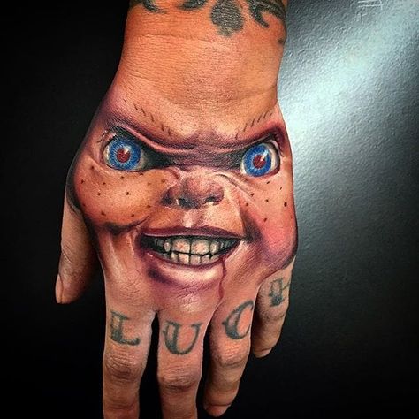 The look of evil. Chucky tattoo by Wes Hogan. #Chucky #ChildsPlay #horror #doll #handtattoo #realism #colorrealism #WesHogan Chucky Forearm Tattoo, Chucky Tattoo Hand, Horror Tattoo Sleeve, Chucky Tattoo Stencil, Chucky Tattoo Design, Chucky Tattoos, Chucky Tattoo, Horror Tattoos, Horror Movie Tattoos