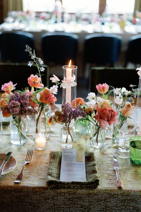 Flower Candle Table Decorations, Wild Flowers And Candles Wedding, Wildflower Candle Centerpiece, Bud Flowers Wedding Table, Spring Tablescapes Ideas French Country, Coloured Candles Wedding, Bus Vases Wedding, Budvase Tablescape Wedding, Wedding Table Candle Centerpieces