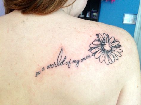 In a world of my own tattoo #tattoo #AliceInWonderLand #Flower #shouldertattoo Part Of Your World Tattoo, In My Own World Tattoo, Its A Small World Tattoos, World With Flowers Tattoo, In A World Of My Own Tattoo, Its A Small World Tattoo Disney, My Own Tattoo, Daisy Tattoos, Symbols Tattoos