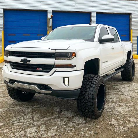 Big lifted White Chevy Silverado 2500HD with Black Custom Grill. Inspiration ideas on lifted trucks and SUV with off-road wheels and overland mods. DIY and easy to install exterior and interior upgrades. #chevy #silverado #mods #liftedtruck #offroad Chevy 1500 Lifted, White Chevy Silverado, Overland Mods, Chevy Trucks Accessories, Chevy Suv, Custom Wheels Trucks, Chevy Trucks Older, Country Trucks, Hot Trucks