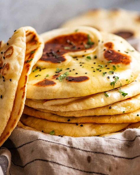 Naan | Recipe Tin Eats ~ Easy recipe for this iconic Indian flat bread; uses instant yeast, either butter or ghee (link given to make ghee), & the dough doesn't require kneading. Fluffy with a chewy, restaurant quality. Brush with garlic-infused ghee or melted butter. Can sprinkle with chopped cilantro & optional nigella seeds. Easy Naan Bread, Pizza Naan, Make Naan Bread, Easy Naan, Pane Naan, Pane Pita, Naan Bread Recipe, Vegan Naan, Homemade Naan Bread