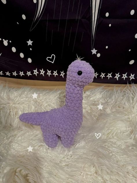 Crochet Purple Dinosaur Plushie Crochet toys free patterns easy #crochettoysfreepatternseasy #crochet #crochettoy #crochetpattern #crochetpatterns 4.321 Crochet Ideas With Purple Yarn, Crochet Purple Plushie, Cute Purple Crochet Ideas, Crochet Purple Amigurumi, Crochet With Purple Yarn, Things To Crochet With Purple Yarn, Purple Things To Crochet, Purple Crochet Ideas, Purple Crochet Projects