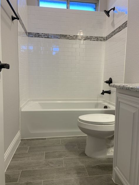 Hall Bath With Tub, Bathroom Shower Remodel Ideas Tile, Bathroom Remodel With Subway Tile, Small Bathrooms With Tubs Ideas, Tile And Paint Bathroom, Tile By Bathroom Sink, Subway Tile With Bathtub, Tubs With Tiled Walls, Dark Tile Bathroom Floor White Walls