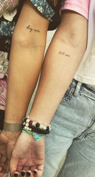 Tatoos To Get With Your Sister, Tattoo Ideas Female Meaningful For Sisters, Sister Birth Year Tattoos, Tattoo Ideas Female Siblings, Delicate Sister Tattoos Simple, Small Tattoos For Sisters Sibling, Similar Tattoos For Sisters, Sister Writing Tattoo, Sister Tattoos For 1 Meaningful