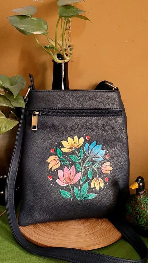 Handpainted Pure Leather bag. For queries contact 9874319973 Leather Bag Painting Ideas, Black Tote Bag Painting Ideas, Painting On Leather Bags, Purse Painting, Diy Bag Painting, Hand Painted Bags Handbags, Tray Painting, Painted Purses, Hand Painted Leather Bag