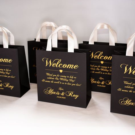 35 Wedding Welcome Bags with Champagne satin ribbon handles and Gold names, Elegant Personalized wedding Thank You gifts & favors for guests. DETAILS: - set of 35 paper bags. 6 colors of bag available for your choice (white, ivory, black, navy blue. light pink, mint); - any color of ribbon - Gold print on the bags; - 4 bag sizes are available: * 4 x 5.2 x 2 inches (10 x 13 x 5 cm); * 6.2 x 7.2 x 2.4 inches (15.5 x 18 x 6 cm); * 6.4 x 8 x 3.2 inches (16 x 20 x 8 cm); * 9.2 x 10 x 4 inches (23 Wedding Welcome Bags Destination, Jasmine Wedding, Wedding Thank You Gifts, Dream Wedding Decorations, Wedding Welcome Bags, Future Wedding Plans, Wedding Gifts For Guests, Welcome Bags, Wedding Decor Elegant