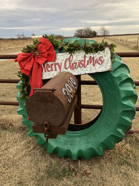 Painted an old tractor tire to make a Christmas wreath. Tractor Tire Pumpkin, Tire Wreath, Tractor Tire Wreath, Christmas Tire Projects, Tire Christmas Decorations, Tractor Tire Ideas, Tractor Tire Christmas Decoration, Tractor Yard Decor, Tractor Christmas Lights