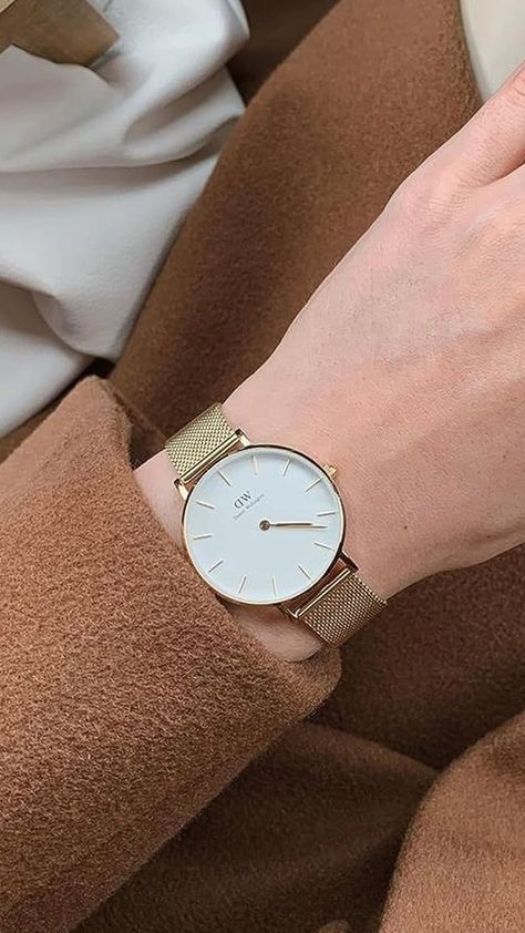 Indulge in timeless elegance with the Daniel Wellington Women Petite Melrose watch. Its delicate rose gold mesh band and dainty white dial create a feminine charm that complements your grace effortlessly. Elevate your everyday style! 💖✨ #DanielWellington #MelroseWatch #FeminineElegance #TimelessCharm #WomensFashion #Accessories #WristCandy Timeless Gold-tone Formal Watch, Daniel Wellington Watch Women Gold, Daniel Wellington Rose Gold, Rose Gold Daniel Wellington Watch, Daniel Wellington Black Watch Women, Daniel Wellington Watch Women, Daniel Wellington Women, Daniel Wellington Watch, Watch Women