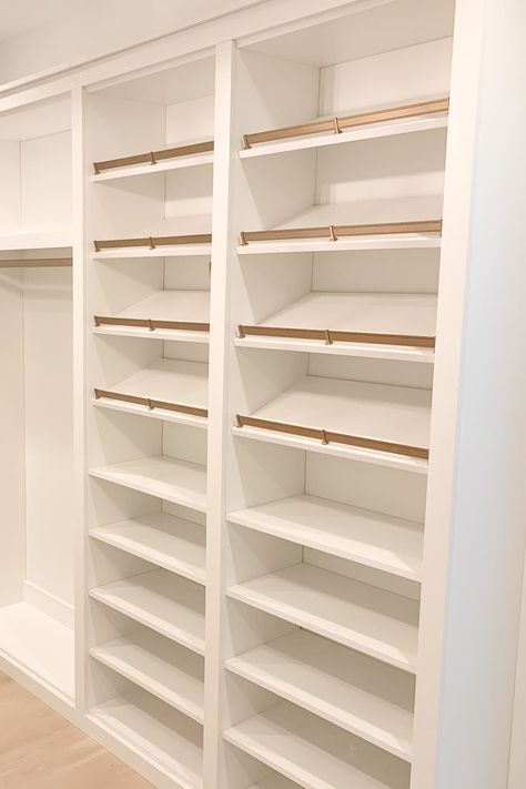 The only thing missing is the shoes! Your shoe rack plays an important role in your closet's organization, allowing you to neatly organize your shoes in any way that works for you. 📸: The Tailored Closet of Nashville Wardrobe Design Shoe Rack, Master Closet Shoe Shelves, Master Walk In Closet Shoe Storage, Walk In Closet Ideas With Shoe Rack, Build A Shoe Rack In Closet, Shoe And Accessory Closet, Diy Angled Shoe Shelves, Shoe Rack In Walk In Closet, Built In Shoe Shelves Closet