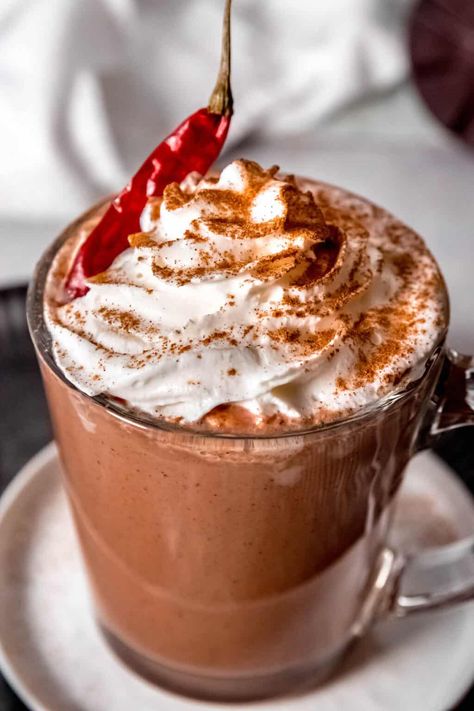 Indulge in my Spicy Mexican Mocha, a blend of dark Mexican chocolate, bold espresso, and warming spices. This drink combines the warmth of cinnamon & the subtle kick of cayenne with the richness of drinking chocolate. It's a delightful fusion of xocolatl, Mexican hot chocolate, and European-style drinking chocolate, finished with freshly brewed espresso for that much-needed caffeine boost. Perfectly balanced, it offers a thick, chocolatey experience with just the right amount of spicy heat. Aztec Hot Chocolate, Mexican Mocha Coffee Recipe, Mexican Mocha Coffee, Mocha Coffee Recipe, Spanish Chocolate, Fireball Shot, Mexican Mocha, Drinking Chocolate, Mexican Chocolate