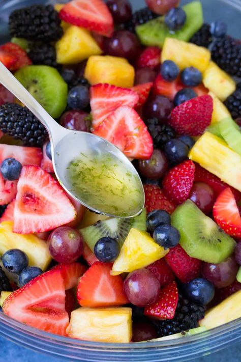 This Fruit Salad with honey lime dressing is sweet and full of fresh flavor. This easy fruit salad recipe is a favorite summer side dish! It's easy to customize with other fruits that are in season. Fruit Salad With Mango, Honey Lime Dressing For Fruit Salad, Low Carb Fruit Salad Recipes, Fresh Fruit Salad Recipe Summer, Grilled Fruit Salad, Fruit Salad With Honey Lime Dressing, Layered Fruit Salad, Fruit Salads For Parties, Brunch Fruit Salad