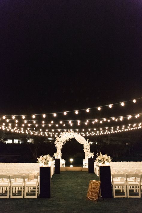 Great Gatsby/Roaring 20s themed wedding ceremony. Night ceremony with bistro lighting. Red Rock Country Club. New Year's Eve Wedding. Floral by Layers of Lovely. Photo by Susie and Will Photographers 20s Themed Wedding, Night Ceremony, Vegas Wedding Venue, Roaring 20s Wedding, Las Vegas Wedding Venue, 20s Wedding, Night Time Wedding, New Years Wedding, Nye Wedding