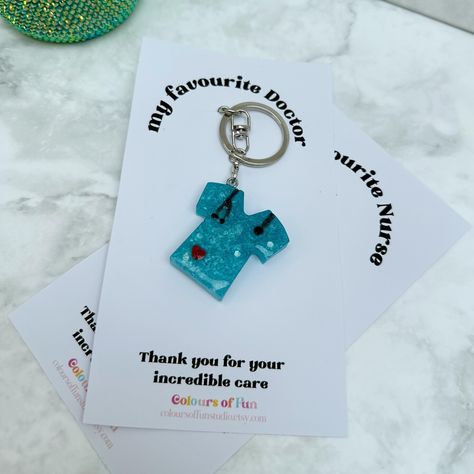 We love and appreciate our doctors and nurses. Show them some love with this keychain 💙💜 . . . #medical #medicine #doctor #nurse #healthcareworker #medicalstudent #doctorgift #nursegift #healthcareworkergifts #keychains #keyrings #resin #resinkeychains #cuteresincrafts #craft #crafting Medical Jewelry, Medicine Doctor, Doctor Gifts, Cute Keychain, Fun Diy Crafts, Fun Diy, Nurse Gifts, Clay Art, Resin Crafts