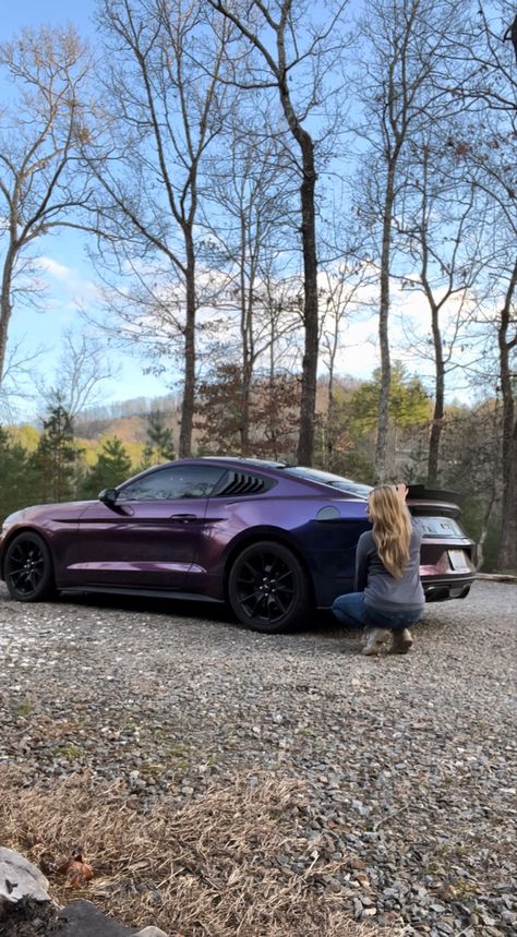 Picture is of a 20 17 mustang GT in midnight purple three wrap. Girl with sandy blond hair is squatted down near the rear part-of the car. Mountains scenery behind. Midnight Purple Vinyl Wrap, Dark Purple Mustang, Dark Purple Car Wrap, Purple Wrapped Car, Mustang Wrap Ideas, Wrapped Mustang, Midnight Purple Car, Mustang Purple, Purple Car Wrap