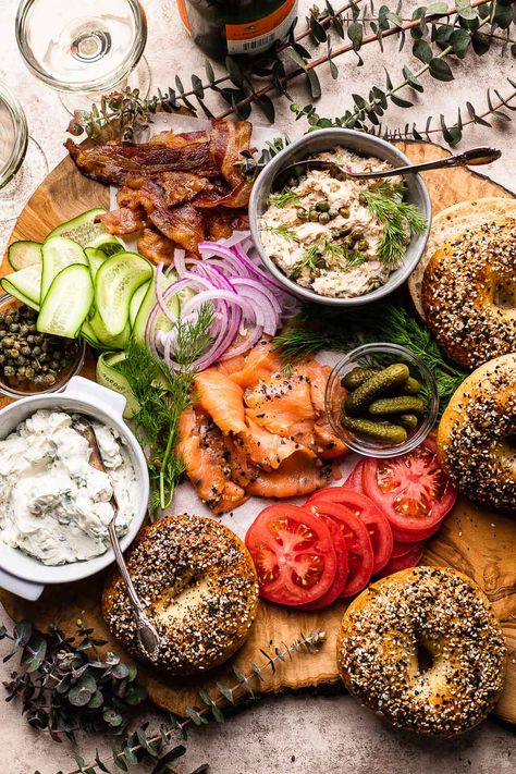 Indulge in a classic brunch favorite with a twist - a Smoked Salmon Bagel Board. Fresh bagels, schmear, smoked salmon, and all the toppings! Salmon Bagel Board, Bagel Board, Types Of Bagels, Smoked Salmon Spread, Salmon Platter, Bagel Bar, Smoked Salmon Bagel, Bagel Toppings, So Much Food