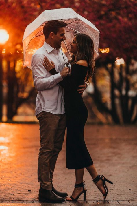 Couples Photos With Umbrella, Rain Engagement Pictures Umbrella, Engagement Photos Umbrella, Raining Engagement Photos, Rainy Engagement Photos Rain, Engagement Pictures In The Rain, Rainy Proposal Pictures, Engagement Rain Pictures, Dark Photoshoot Couple