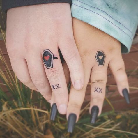 Coffin Finger Tattoo, Couple Finger Tattoo Ideas, Wedding Ring Tattoos For Couples, Ring Tattoos For Couples, Ring Finger Tattoo Couple, Wedding Ring Tattoo Ideas, Wedding Ring Tattoos, Finger Tattoo Ideas, Coffin Tattoo