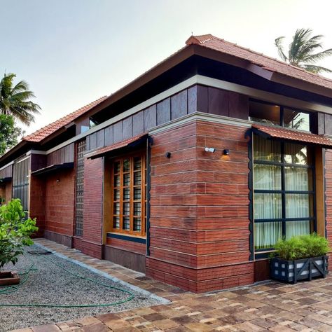 Laterite Stone House, Tamil House, Tiles Facade, Modern Window Grill, Brick Roof, Cottage Studio, Brick Houses, Stone Exterior Houses, Natural Building Materials