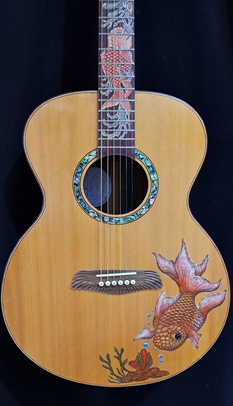 Blueberry NEW IN STOCK Handmade Acoustic Guitar Grand Concert Fish Watch and listen to a Blueberry Grand Concert Guitar in Action https://youtu.be/D_A5TUK-djE Blueberry Handmade Acoustic Guitars are made on the tropical island of Bali by our experienced team of traditional wood carvers and artisans who have been practicing their craft for generations.   Our unique workshop has been creating singular objects of musical and visual beauty since 2005.   This is your opportunity to own a unique instr Acoustic Guitar Art, George Morris, Walk Off The Earth, Tenor Guitar, Baritone Guitar, Instruments Art, Guitar Painting, Steel Guitar, Wood Carver