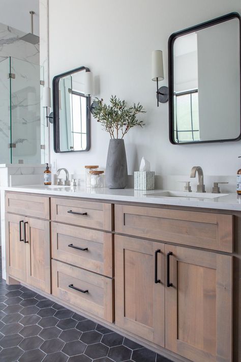 Wood vanities and a black hexagonal tile floor set this bathroom apart from a more basic neutral look. See the pretty room at HGTV.com. Makeover Kamar Mandi, Black Floor Tiles, Moore House, Wood Bathroom Vanity, Transitional Bathroom, Master Bath Remodel, Bathroom Remodel Designs, Up House, Upstairs Bathrooms