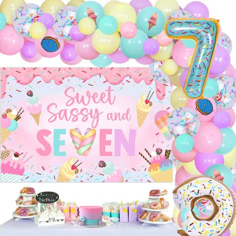 PRICES MAY VARY. Sweet sassy and seven: Our Sweet 7th Birthday decorations will create a magical and memorable birthday party for your little girl. The vibrant colors and sweet designs will make her feel like a princess on her special day. Donut ice-cream theme: The theme of our party decorations is centered around delicious donuts. The sweet sassy and seven backdrop features a colorful donut design with the words "Sweet, Sassy, and Seven" in bold letters. The donut balloons are also a great add Donut Bday Party Ideas, 7th Birthday Girl Themes, Birthday Party Themes For Girls Age 7, Birthday Party Ideas For 7 Year Girl, Seven Birthday Theme, Sweet Treat Birthday Party Theme, Sweet And Sassy Birthday Party, Seven Year Old Birthday Party Ideas, Girl 7th Birthday Party Ideas