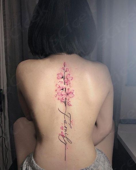 The cherry blossom tattoo is a symbol of fleeting beauty and the transient nature of life. Its delicate petals, in shades of pink and white, evoke a... Tattoos Behind Ear, Floral Back Tattoos, Dragons Tattoo, Basic Tattoos, Cherry Tattoos, Tattoos For Women Flowers, Spine Tattoos For Women, Tattoos For Black Skin, Red Ink Tattoos