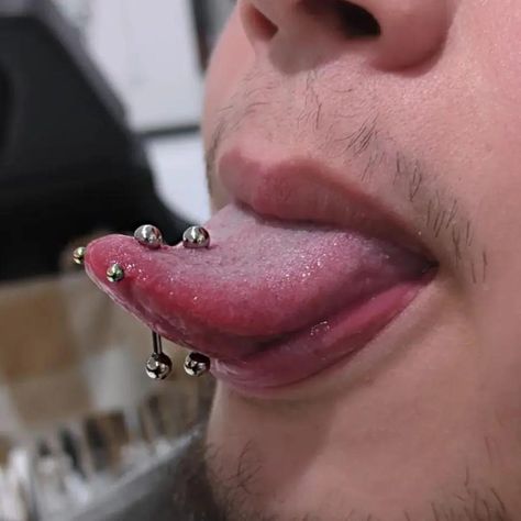 DYNAMIC DUO 😜  DOUBLE TONGUE PIERCING BY @shinysharpthings  Soho, Union Square, and Williamsburg  11AM-9PM 7 DAYS A/W🕘 WALK-INZ OR BOOK ONLINE..📕 TATTOOS & PIERCINGS, NO ATTITUDE, NO MISERABLE HOOPS TO JUMP THROUGH....🚫  WALK-INZ WELCOME OR BOOK ONLINE AT  ⚔️livebytheswordtattoo.com⚔️ . . . . #doubletonguepiercing #tonguepiercing #bodypiercing #piercing #unionsquare #nyc Male Tongue Piercing, Male Belly Button Piercing, Tongue Piercing Men, Piercings Men, Piercing Men, Kazuichi Souda, Double Tongue Piercing, Surface Piercing, Cool Piercings