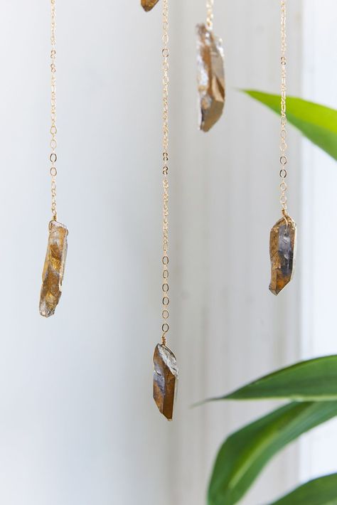 https://s7d5.scene7.com/is/image/UrbanOutfitters/50074368_070_e?$xlarge$=&fit=constrain&qlt=80&wid=1366 Witchy Mobile, Crystal Decor Ideas, Gift Guide Design, Crystal Mobile, Pyrite Stone, Pyrite Pendant, Pyrite Crystal, Chain Loop, Hanging Mobile