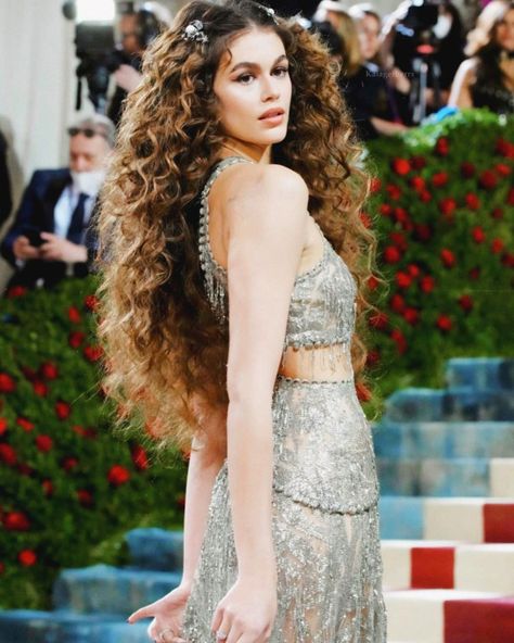 Pageant Curly Hairstyles, Curly Hair With Flowers In It, Curly Mermaid Hairstyles, Curly Goddess Hair, Long Ethereal Hair, Big Curly Hair Wedding, Victorian Curly Hairstyles, Bridesmaids Hairstyles For Curly Hair, Wedding Dress Curly Hair