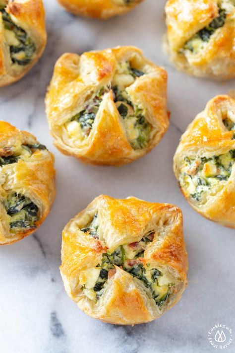 These Feta Spinach Bacon Puffs are the perfect party appetizer. A creamy filling with salty bacon and tangy feta is nestled in crispy, flaky puff pastry made easy in a muffin tin! #appetizer #puffpastryrn Puff Pastry Appetizers Easy, Spinach Puffs Recipe, Puff Pastry Recipes Appetizers, Bacon Puffs, Spinach Puff Pastry, Spinach Puff, Puff Pastry Appetizers, Puff Pastry Filling, Pastry Appetizer