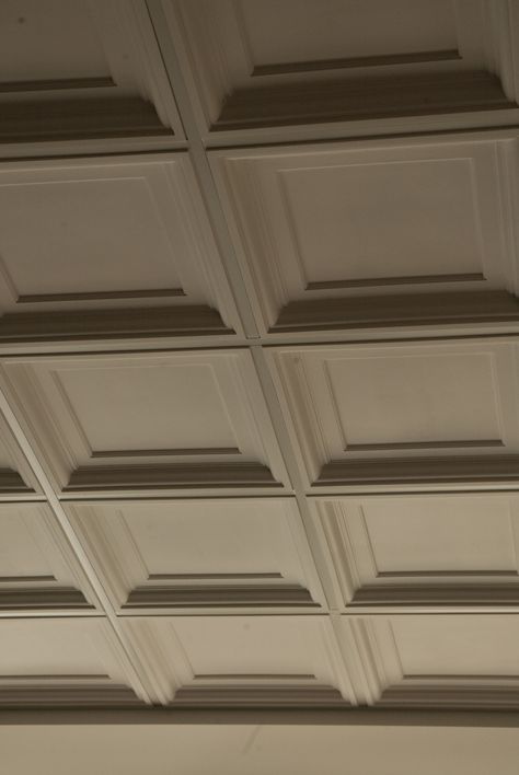 This is one of my favourite ceiling tiles.  It's like a plaster of paris - they actually pour into a mold to create the tile.  It fits into a typical 2x2 t-bar ceiling grid.  We have some left over and have been selling them for use as headboards.  Put 3 in a row and with a little finish carpentry - you have a really unique headboard! Coffer Ceiling, Coffered Ceiling Design, Interior Ceiling Design, Ceiling Grid, Bar Ceilings, House Ceiling Design, Ceiling Design Living Room, Ceiling Design Modern, Ceiling Detail