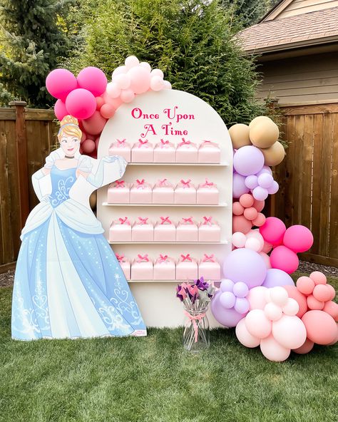 Olivia's 3rd Disney Princess Birthday Party | Just A Tina Bit Once Upon A Time Balloon Garland, Princess Theme Table Decorations, Princess Party Balloon Garland, Party Favors Wall, Once Upon A Time Themed Party, Once Upon A Time Party Favors, Once Upon A Time Princess Party, Princess Party Balloon Arch, Magical Princess Birthday Party