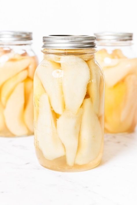 If you're looking for a straightforward, easy canning recipe, then this recipe for how to can pears is the one for you! A simple syrup is poured over sliced pears, and into the water bath they go. A few minutes later, the pears are ready to go for months to come! | wyseguide.com #canning #recipe #pears #preserving #fall How To Can Pears, Can Pears, Pear Recipes Easy, Peach Jalapeno Jam, Canning Pears, Beef Jerky Recipe, A Few Minutes Later, Wyse Guide, Jerky Recipe