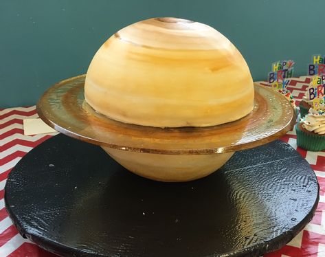 This is the Saturn Cake that I made for my son's 5th birthday!  The northern hemisphere is chocolate and the southern hemisphere is a dense butter cake. The rings are sugar glass. The fondant is painted with a wet brush. Saturn Cake Ideas, Saturn Birthday Cake, Astronomy Cake, Saturn Cake, Jupiter Cake, Easy Birthday Desserts, Planet Cake, Cookie Recipes Decorating, Sugar Glass