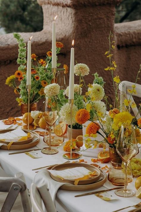 The intimate reception continued the elegance with tables decorated with delicate floral arrangements, fresh fruit displays, gold accents, and chic table settings, adding sophistication and charm to the occasion. | Image by Heather Jackson Yellow Table Setting, Modern Tablescape, Yellow Table, Table Setting Decor, Pretty Tables, Orange Wedding, Yellow Wedding, Wedding Table Settings, Wedding Tablescapes