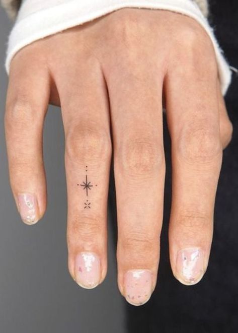 25 Beautiful and Meaningful Finger Tattoos for Women Colored Finger Tattoos For Women, Wrist And Finger Tattoos For Women, Finger Tattoo Meaningful, Symbols For Finger Tattoos, Intricate Finger Tattoo, Women Thumb Tattoos, Small Banjo Tattoo, Small Meaningful Finger Tattoos, Finger Tattoos And Meanings