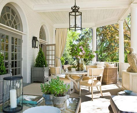 Spacious Sanctuary - This large outdoor porch provides the perfect summertime entertaining area. The grand space was split into two seating areas, one with a dining table and one with a sofa and chairs. A palette of soft neutrals unifies both areas. Outdoor drapes can be drawn to diffuse bright sunlight to ensure diners don't need to squint their way through a meal. Lanterns Diy, Outdoor Drapes, Porch Design Ideas, Home Porch, Front Porches, Outside Living, Porch Design, Outdoor Porch, Sun Set