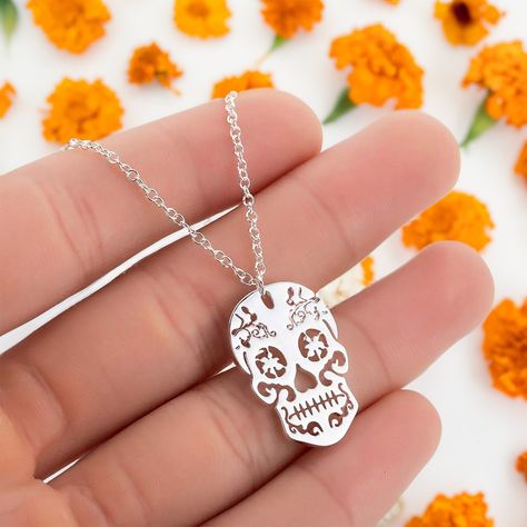 👻✨ Spooky season is here, #Fridamaniacs! Alongside our Frida-inspired jewelry, check out our Day of the Dead collection! Discover cool earrings, charms, pins, and this stunning Mexican Sugar Skull pendant charm. Limited edition and available now at www.fridamaniacs.com. Don’t miss our site-wide sale—shop now! 💀💖 Frida Kahlo Earrings, Sugar Skull Necklace, Mexican Sugar Skull, Earrings Charms, Mexican Jewelry, Skull Necklace, Skull Pendant, Inspired Jewelry, The Ultimate Gift