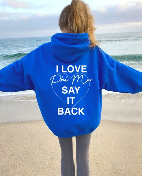 I Love Phi Mu Say It Back Sorority Hoodie. Available in White, Black, Light Blue, Royal, and Light Pink -- just select your desired color using the dropdown menu! This listing is for PHI MU. We offer our designs for 26 different sororities, to find yours use our search bar or menu located on our shop. Return Policy: We do not offer returns as our items are custom made-to-order, made specifically for you! If you need help determining your size, please feel free to send us a DM. ♥ SIZING ♥ Unisex Vsco Hoodie, Sorority Sweatshirts, Big Little Gifts, Alpha Xi Delta, Alpha Sigma Alpha, Alpha Chi Omega, Custom Hoodie, Delta Zeta, Alpha Chi