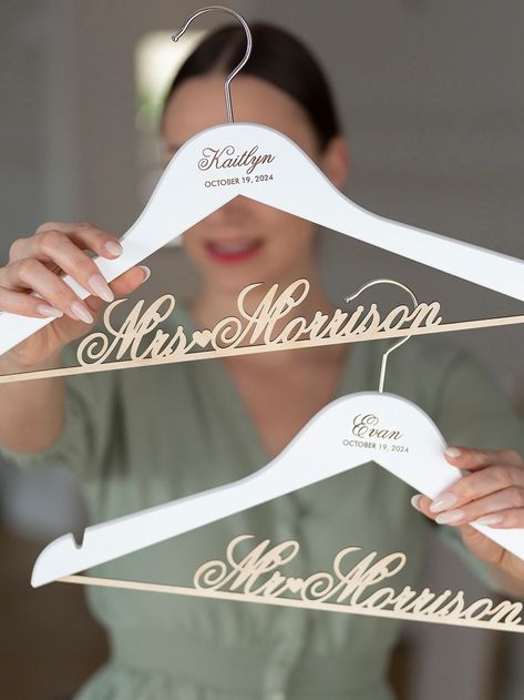 Elevate the joy of wedding celebrations with our exquisite Bride and Groom Hanger Set, a thoughtful and stylish addition to any couple's journey towards forever. This pre-designed set of hangers includes 1 bride hanger and 1 groom hanger. There's no color, font or design selection for this product, your hangers will look exactly the same as in the example picture. Both hangers will be white with natural/dark brown engraving and natural/light wood lettering bar. Ribbon bows can be added separatel Groom Hanger, Bride Hanger Personalized, Hangers Wedding, Wood Lettering, Name Hangers, Hanger Set, Bridesmaid Hangers, Bride Hanger, Wedding Hangers Personalized