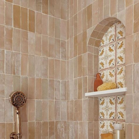 Emily Pueringer Design Studio on Instagram: "Nestled in the heart of Miami, Florida, we embarked on an incredible journey to breathe new life into our client’s Spanish colonial bathroom. The hand-painted terracotta tiles with cheerful pops of yellow were strategically placed in niches alongside glazed zellige tiles that come together in a mosaic that not only pays homage to the home’s history but also embraces contemporary aesthetics with open arms. The art of installing extra thick handmade terracotta + zellige tile has its own challenges, which the installers mastered while also mitering every curved tile edge in the arched niche exemplifying a meticulous attention to detail and requiring special skill. This primary bathroom renovation is more than just a visual overhaul; it’s a living t Terracotta Zellige Bathroom, Emily Pueringer, Terracotta Bathroom Tiles, White Glazed Terracotta Tile, Terracotta Zellige, Spanish Tile Bathroom, Spanish Colonial Bathroom, Cle Terracotta Tile, Glazed Terracotta Tile Backsplash