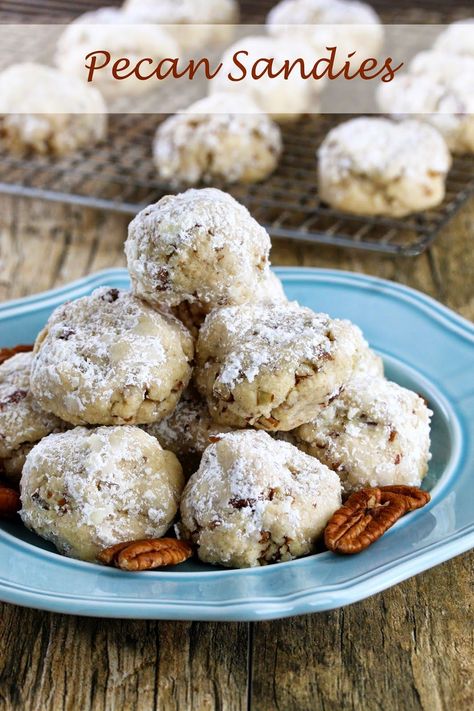 Pecan Sandies are a delicious Christmas treat that are a must make for any holiday cookie platter. I love the nutty crunch. The powdered sugar makes them all festive too with a kiss of “snow.” In fact, my daughter got all excited thinking it had somehow snowed in the house right on the cookies. This... Pecan Sandies Cookies, Classic Snowball Cookies, Sandies Recipe, Sandies Cookies, Mexican Wedding Cookies Recipes, Wedding Cookies Recipe, Pecan Snowballs, Pecan Snowball Cookies, Pecan Sandies