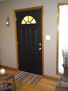 Black Front Door. Do not like with stained trim, would the grey be any better? Black Interior Front Door, Hygge Decor Inspiration, Staircase Gallery Wall, Painting Interior Doors Black, Home Staircase, Staircase Gallery, White Baseboards, Interior Front Door, Gallery Wall Staircase