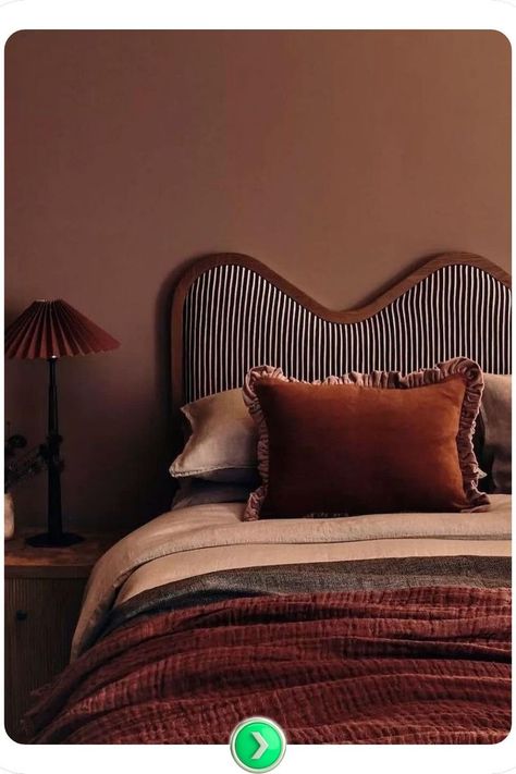 A warm rust-toned accent wall brings retro charm to your bedroom decor, creating a welcoming and cozy feel with a unique color perfect for autumn-inspired aesthetics. Pillow Reference, Dark Accent Wall, Brown Accent Wall, Dark Accent Walls, Grey Accent Wall, Green Accent Walls, Accent Wall Ideas, Black Accent Walls, Dark Grey Walls