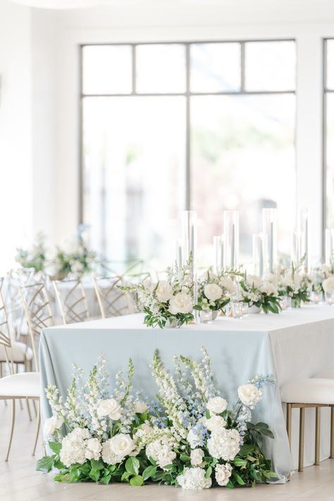 White Rose Hydrangea Centerpiece, Long Head Table Flowers, Delphinium Centerpiece Wedding, Blue And White Centerpieces Wedding, Blue Green White Wedding, Hydrangea Wedding Centerpieces, Floral Hedge, Wedding Farm Table, Farm Table Centerpiece