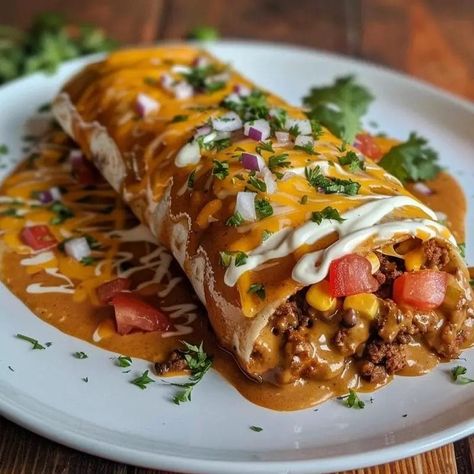 Wet burritos are a beloved comfort food, known for their hearty fillings, rich sauces, and cheesy toppings. They bring together the best elements of traditional Mexican cuisine in a single, indulgent dish. The name “wet” comes from the generous amount of sauce that smothers the … El Monterey Burritos Recipes, Wet Burrito Recipe Ground Beef, Wet Burrito Recipe, Mini Burritos, Wet Burrito Recipes, Wet Burrito, Beef Burritos, Chile Peppers, Burritos Recipe