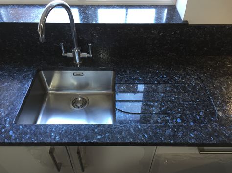 This stunning Blue Pearl GT is textured with a high gloss to allow for an additional sensory experience. With its beautiful looks and textured finish, it makes for a wonderful worktop for any kitchen Black Pearl Leathered Granite, Small Kitchen Modular Design, Sensa Silver Blue Granite Countertops, Black Pearl Granite Countertops Farm House, Volga Blue Granite, Blue Granite Countertops, Black Granite Kitchen, Blue Pearl Granite, Sensa Silver Blue Granite