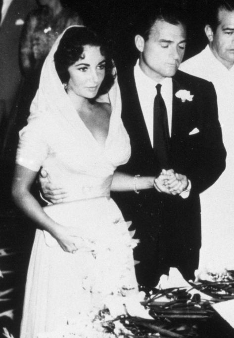 Elizabeth Taylor’s Wedding Dresses: See the 8 Colorful Gowns She Wore Down the Aisle Elizabeth Taylor Wedding Dress, Elizabeth Taylor Wedding, Iconic Brides, Colorful Gowns, Celebrity Brides, Famous Wedding Dresses, Hilton Wedding, Colorful Gown, Celebrity Wedding Photos